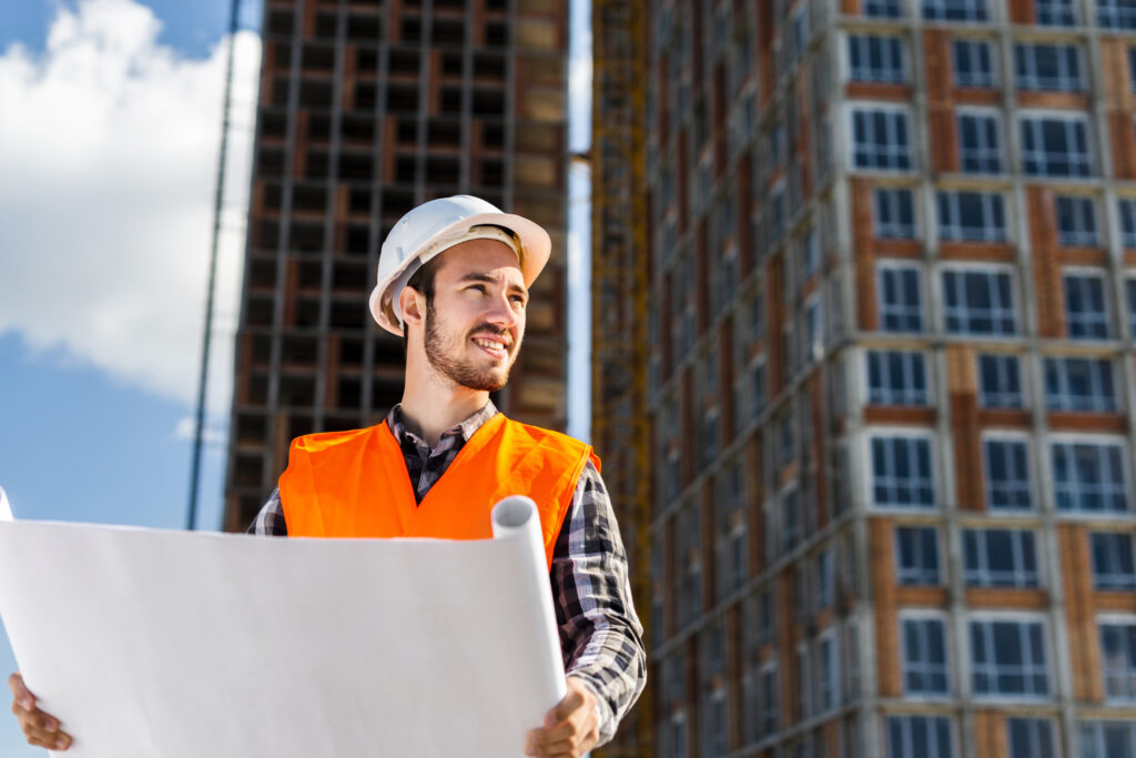 Engineer reviewing a plan in the middle of a civil work